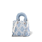 mini handbag with striking cinched design and pearl accents