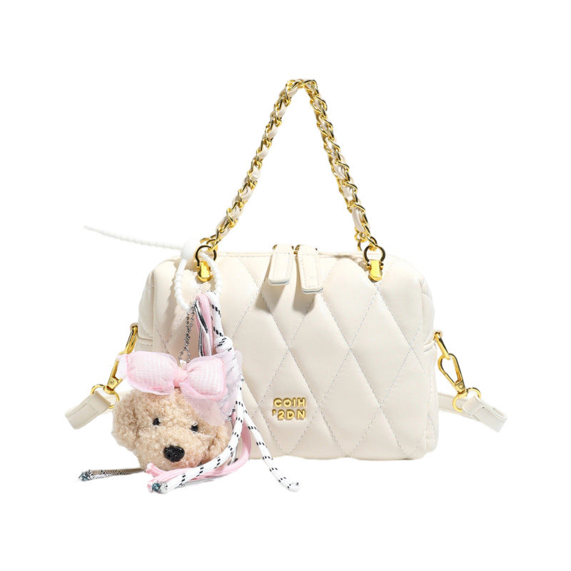 stylish mini handbag with playful animal pendant
