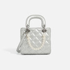 Women’s mini handbag with pearl-embellished chain and quilted design