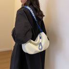 Fashionable shoulder bag with adjustable carrying strap