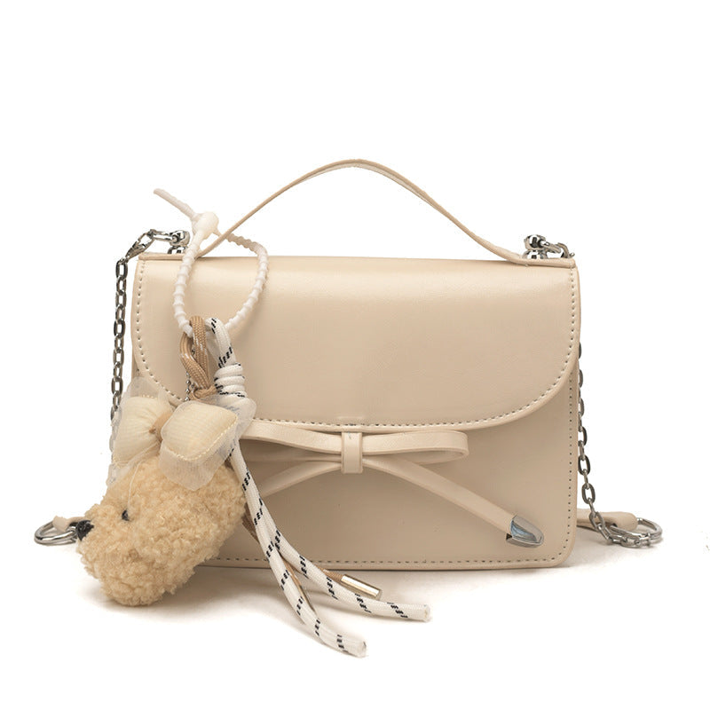 Ladies elegant mini handbag with cute pendant