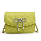 mini handbag with luxurious quilted pattern and sparkling chain pendant