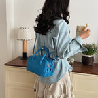 Women’s mini handbag with textured faux leather and elegant design