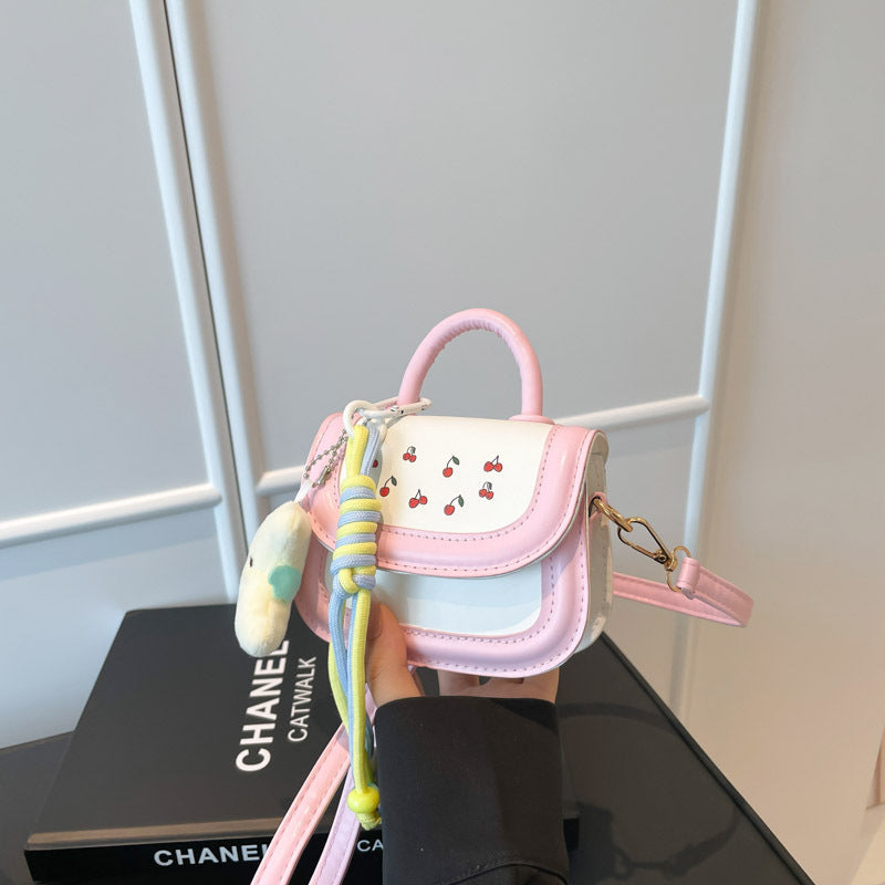 mini handbag with cheerful cherry design and charming charms