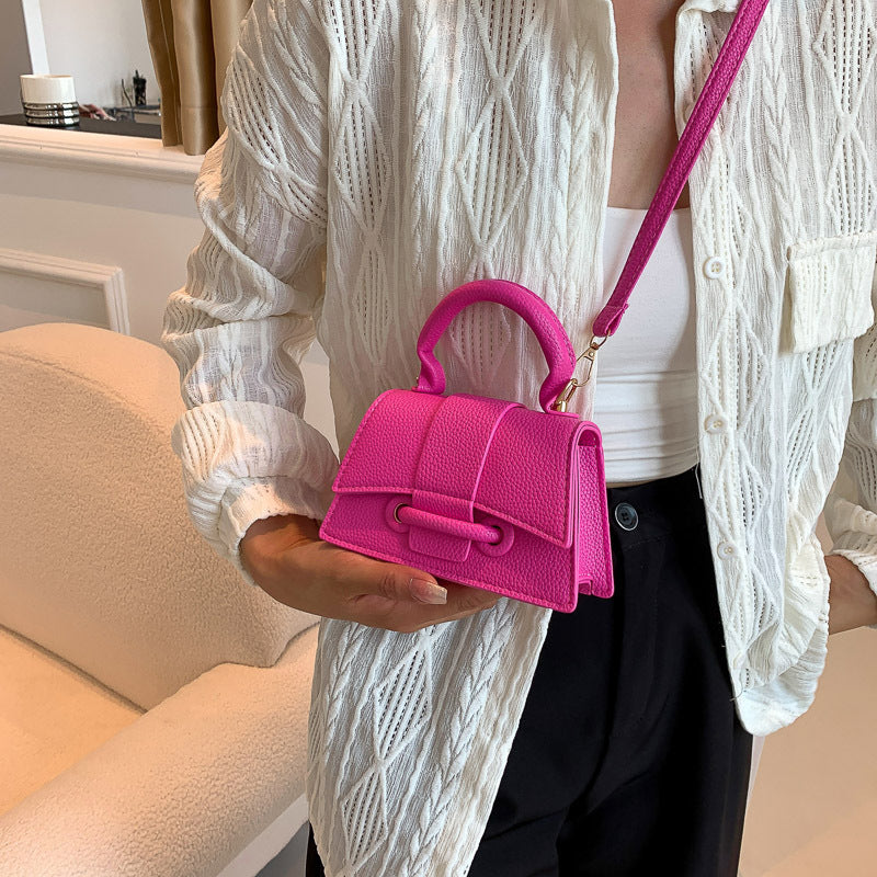 mini handbag with textured leather and stylish closure