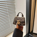 Women’s mini handbag with decorative chain strap