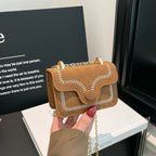 mini handbag with elegant quilted pattern and golden accents