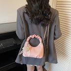 mini handbag with voluminous ruffle design and trendy pendants