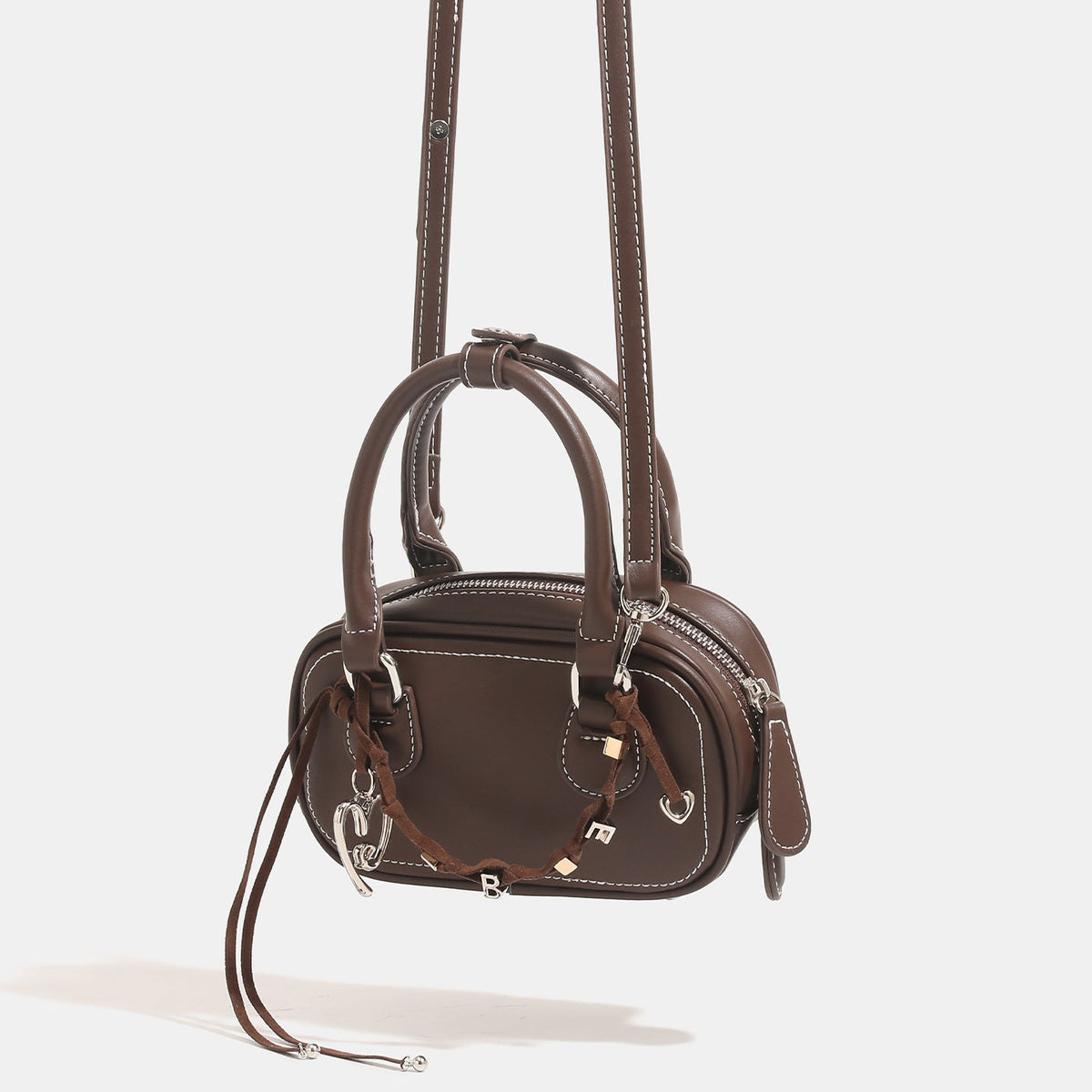 Ladies mini handbag with playful drawstring and elegant accents