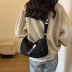 Fashionable shoulder bag with adjustable carrying strap