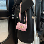 mini handbag with quilted design and golden closure