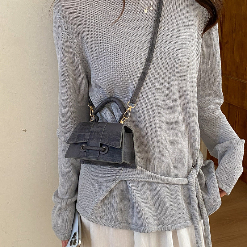 Ladies elegant mini handbag with textured design