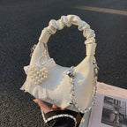 mini handbag with voluminous ruffle design and trendy pendants