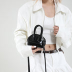 mini handbag with elegant glossy finish and removable shoulder strap