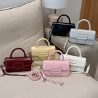 mini handbag with decorative snap closure