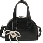 mini handbag with stylish crocodile look and detachable pendant