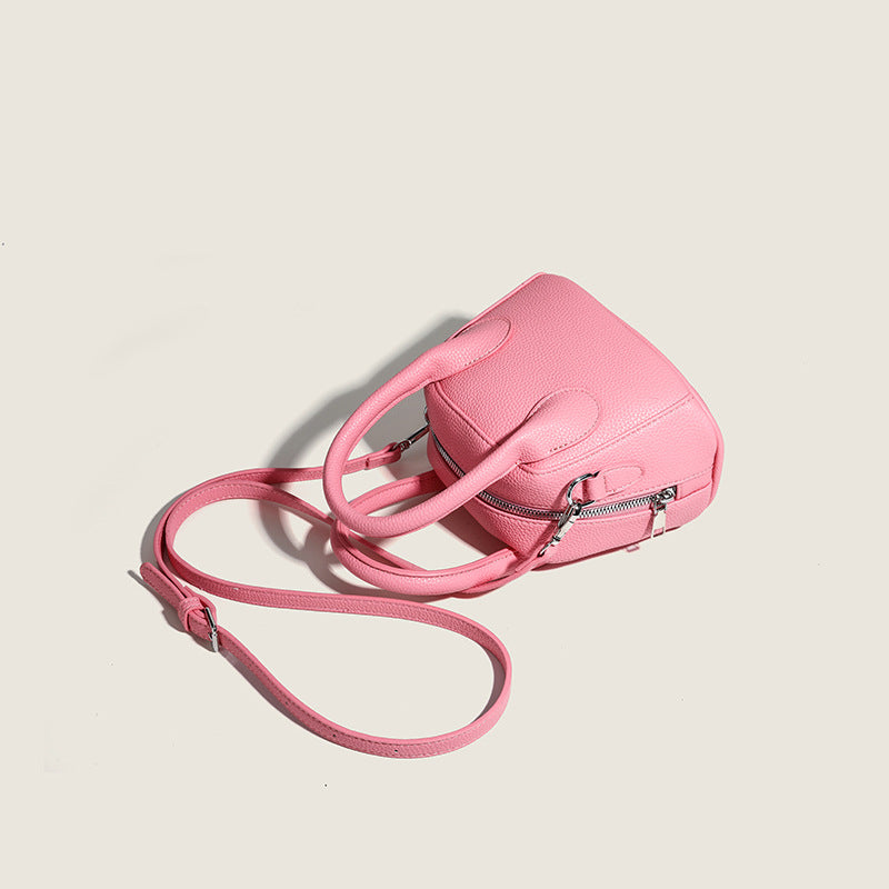 mini handbag with textured upper material and removable shoulder strap