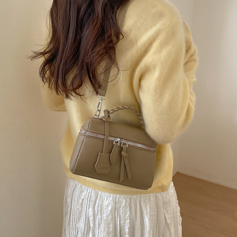 mini handbag with fine decorative seams and removable shoulder strap