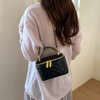 mini handbag with gold chain accent and textured design