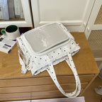 Handbag with Transparent Compartment Division and Playful Application Design