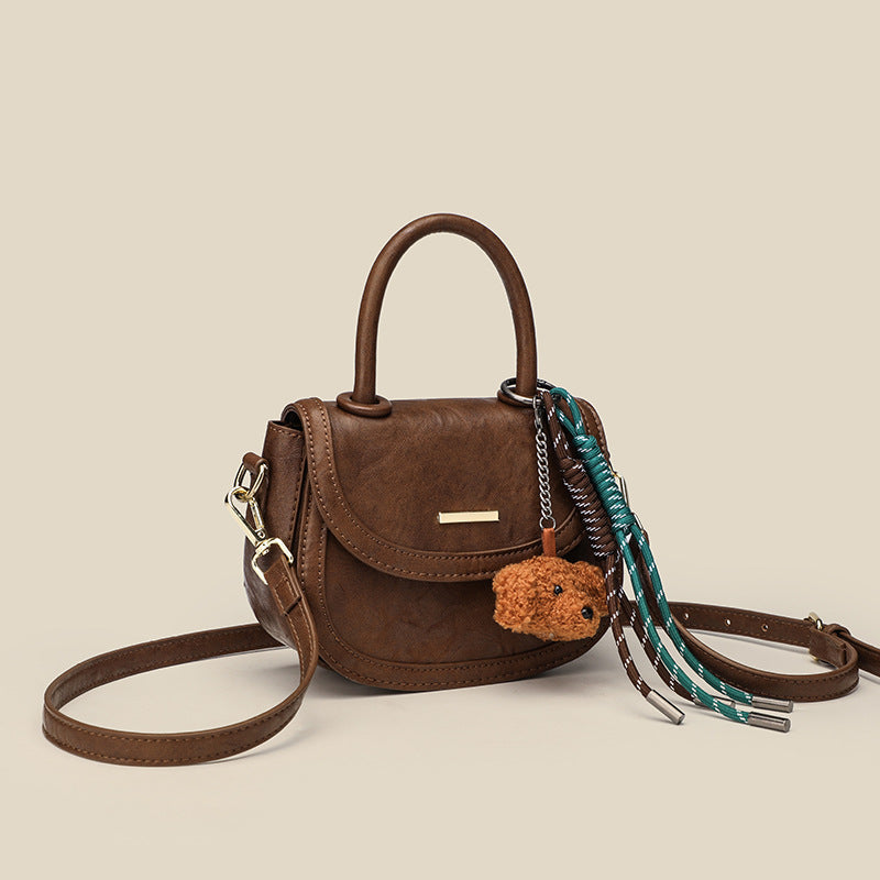 mini handbag with playful detail and high-quality synthetic leather