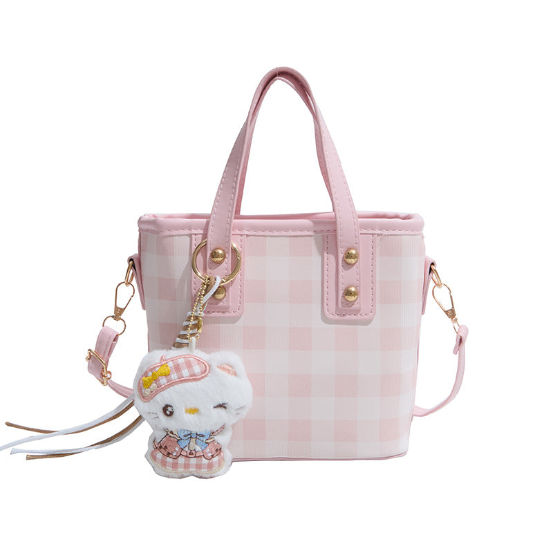 mini handbag with checkered design and playful pendant