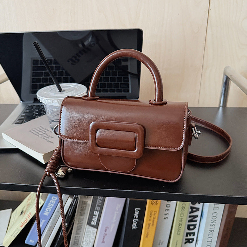 mini handbag with detachable shoulder strap and modern design