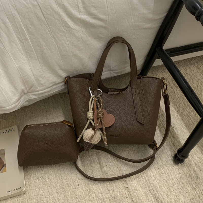 Ladies mini handbag in elegant design with charming pendant