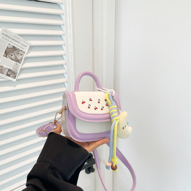 mini handbag with cheerful cherry design and charming charms