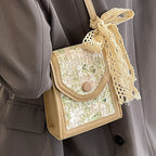mini handbag with floral jacquard pattern and playful drawstring Nord bags