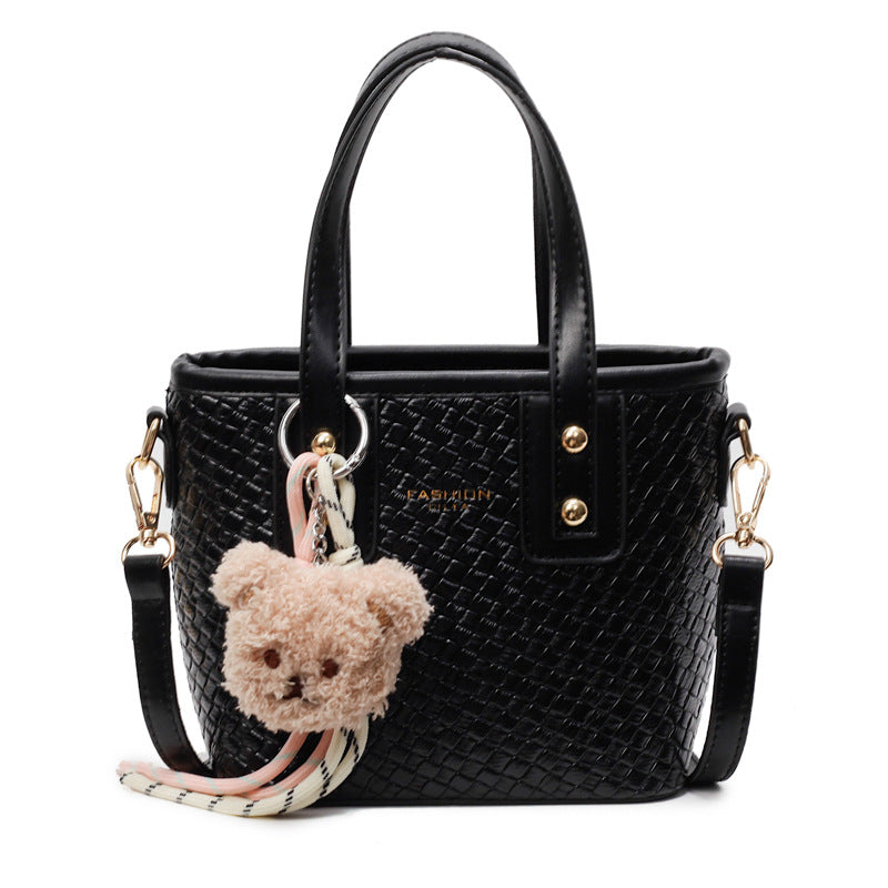 mini handbag with textured design and fluffy pendant