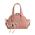 mini handbag with stylish crocodile look and detachable pendant