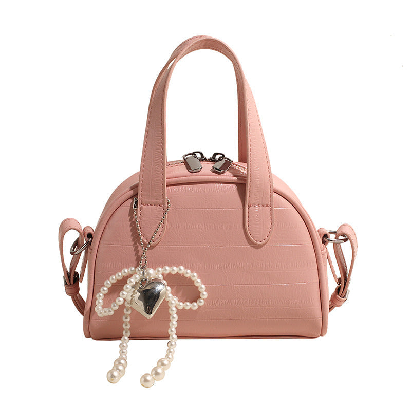 mini handbag with stylish crocodile look and detachable pendant