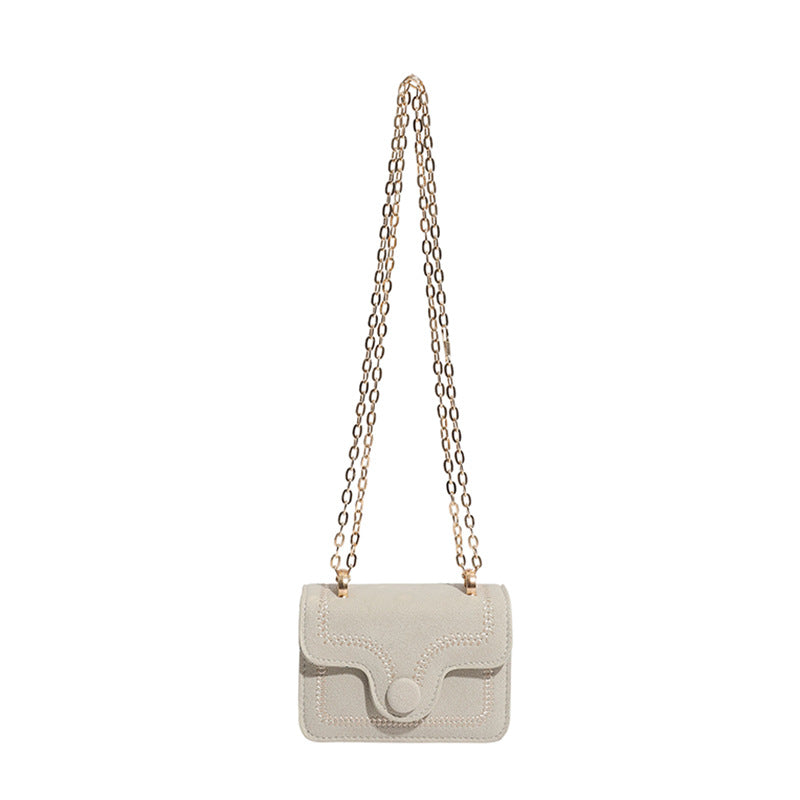 mini handbag with elegant quilted pattern and golden accents