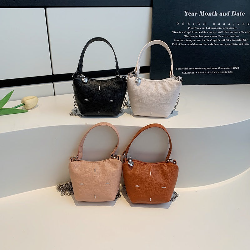 mini handbag with shiny chain and textured upper material