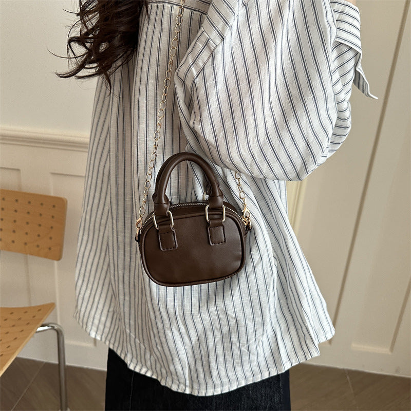 mini handbag with detachable chain and elegant design