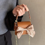 mini handbag with decorative bow design