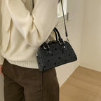 mini handbag made of high-quality material with a textured surface