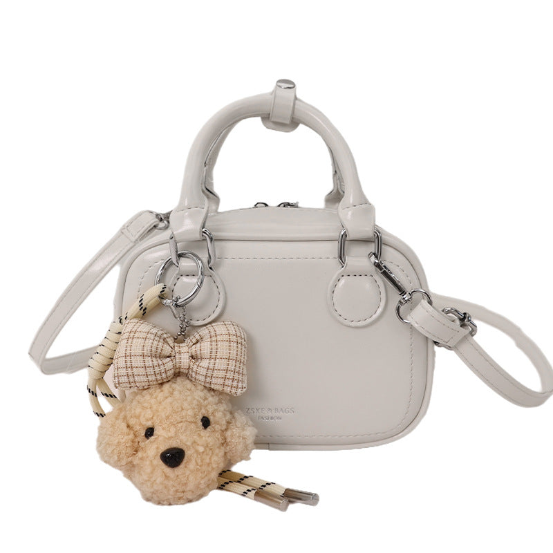 Women’s mini handbag with detachable plush pendant
