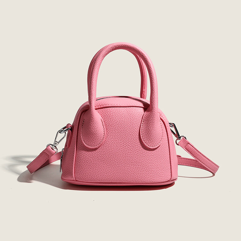 mini handbag with textured upper material and removable shoulder strap