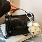 Ladies elegant mini handbag with cute pendant