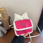 Women’s mini handbag with playful bow detail