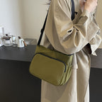 Practical shoulder bag with versatile storage compartments