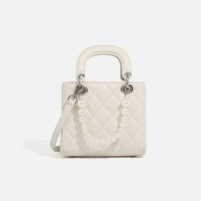 Women’s mini handbag with pearl-embellished chain and quilted design