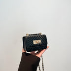 mini handbag with quilted design and golden closure