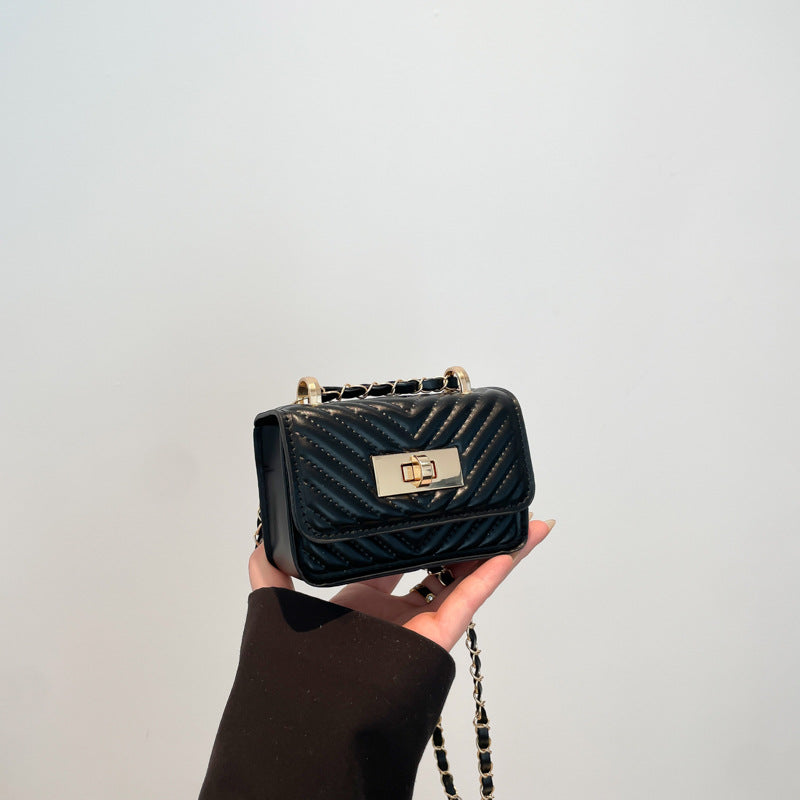 mini handbag with quilted design and golden closure