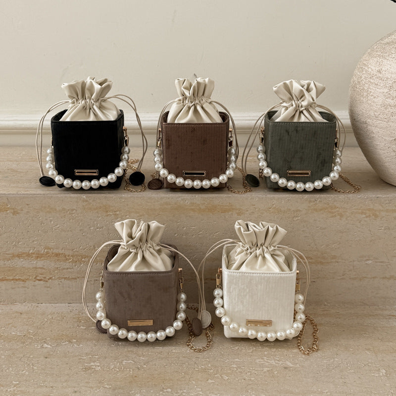 Women stylish mini handbag with drawstring and pearl accent Nord bags