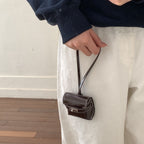 mini handbag made of high-quality synthetic leather with playful closure