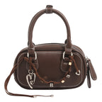 Ladies mini handbag with playful drawstring and elegant accents