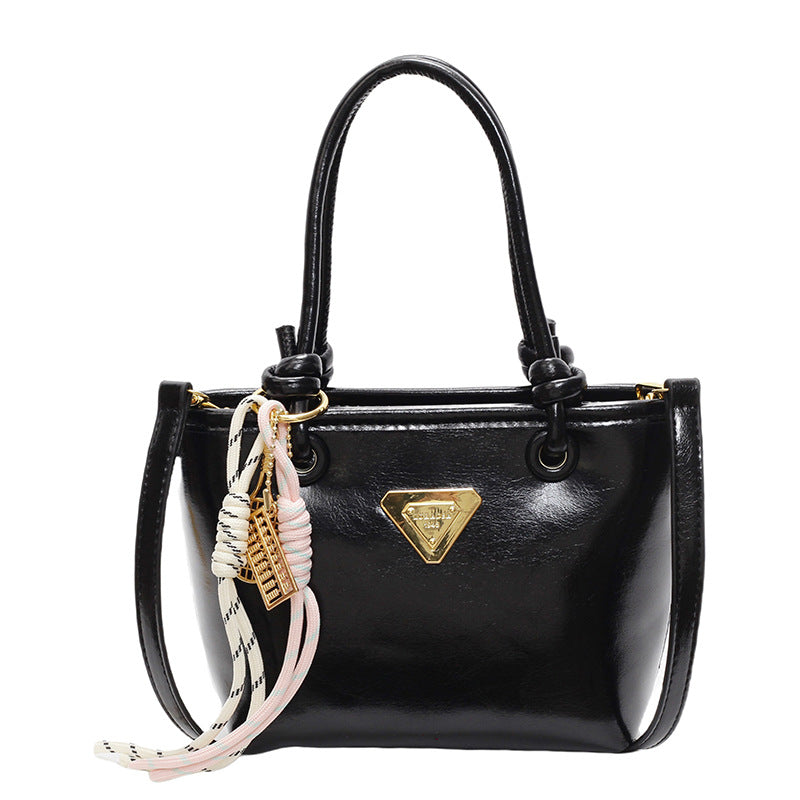 Mini handbag with elegant details and practical shoulder strap